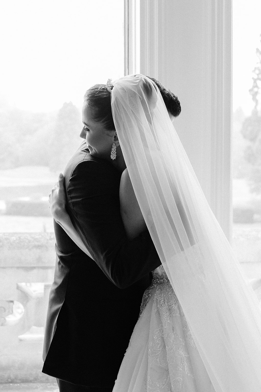 Bride and groom hugging each other
