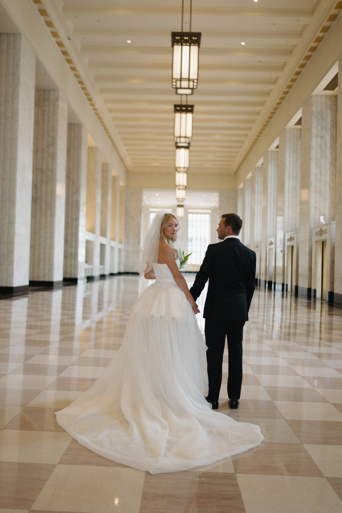 Sophisticated editorial wedding photography at NOBU Hotel Chicago featuring Lauren Alatriste's fashion forward approach to luxury wedding preparation, creating magazine-worthy imagery that combines editorial excellence with authentic emotion.