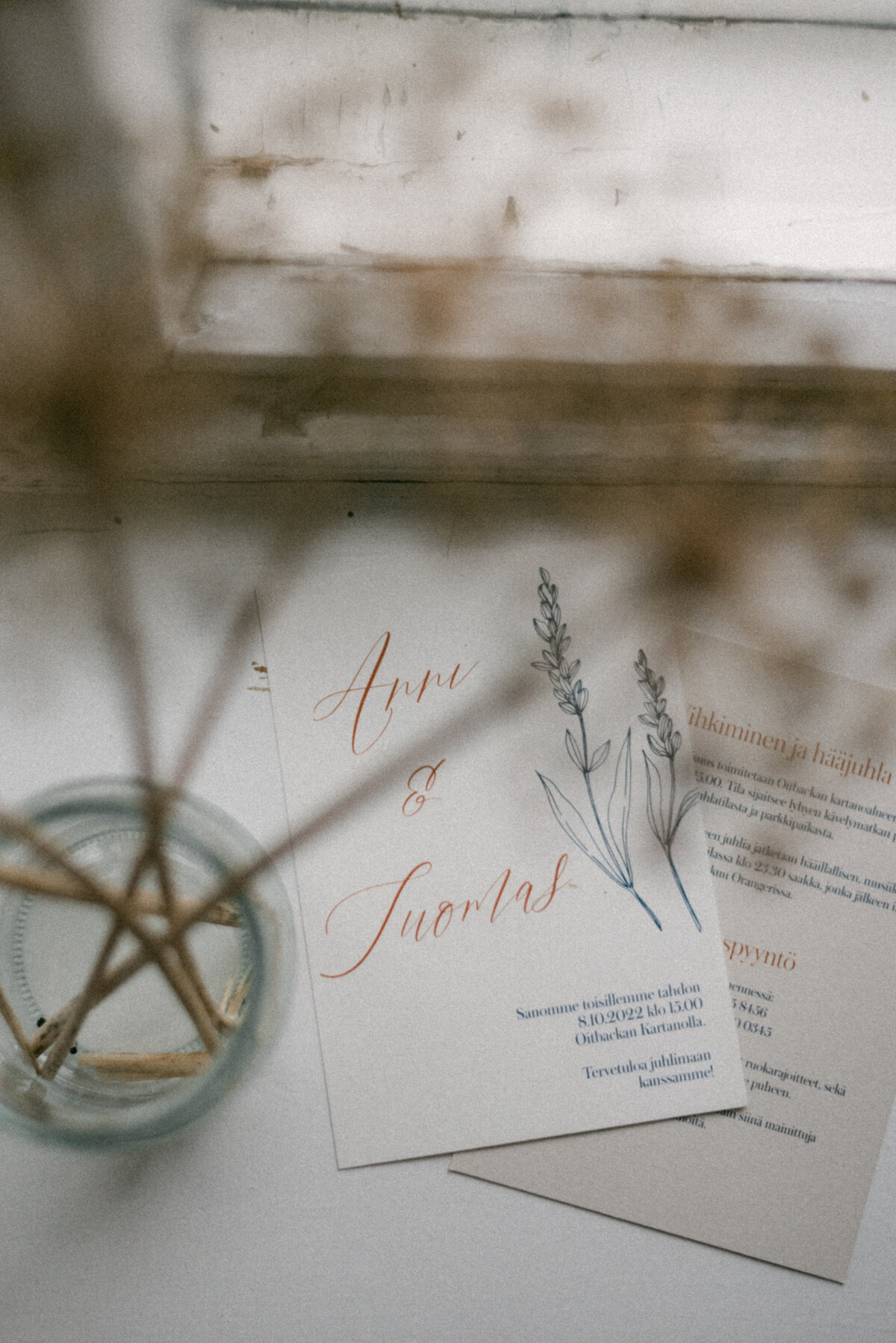 Wedding invitation and dried flowers in the orangerie in Oitbacka gård