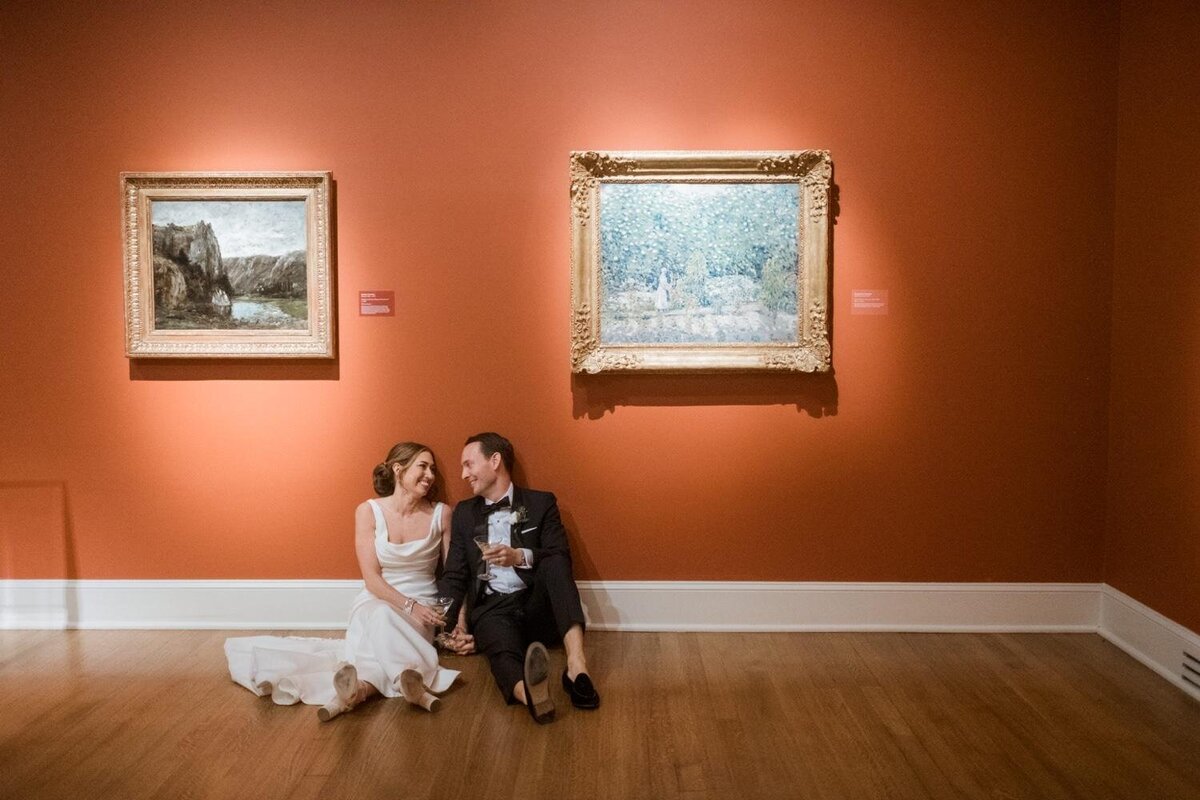 Bride-and-groom-sitting-between-paintings-at-New-Orleans-Museum-of-Art-Wedding-NOMA-.jpg
