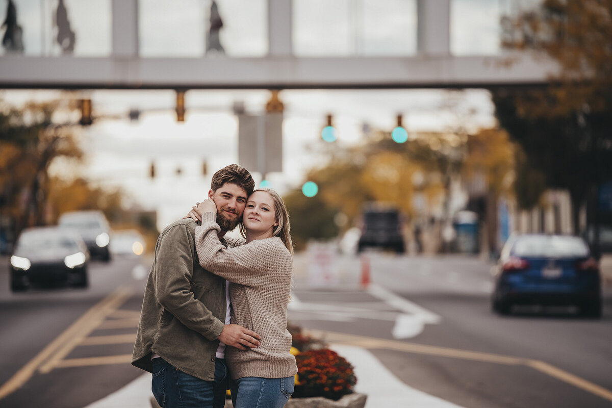 woman and man standing together in an intersection