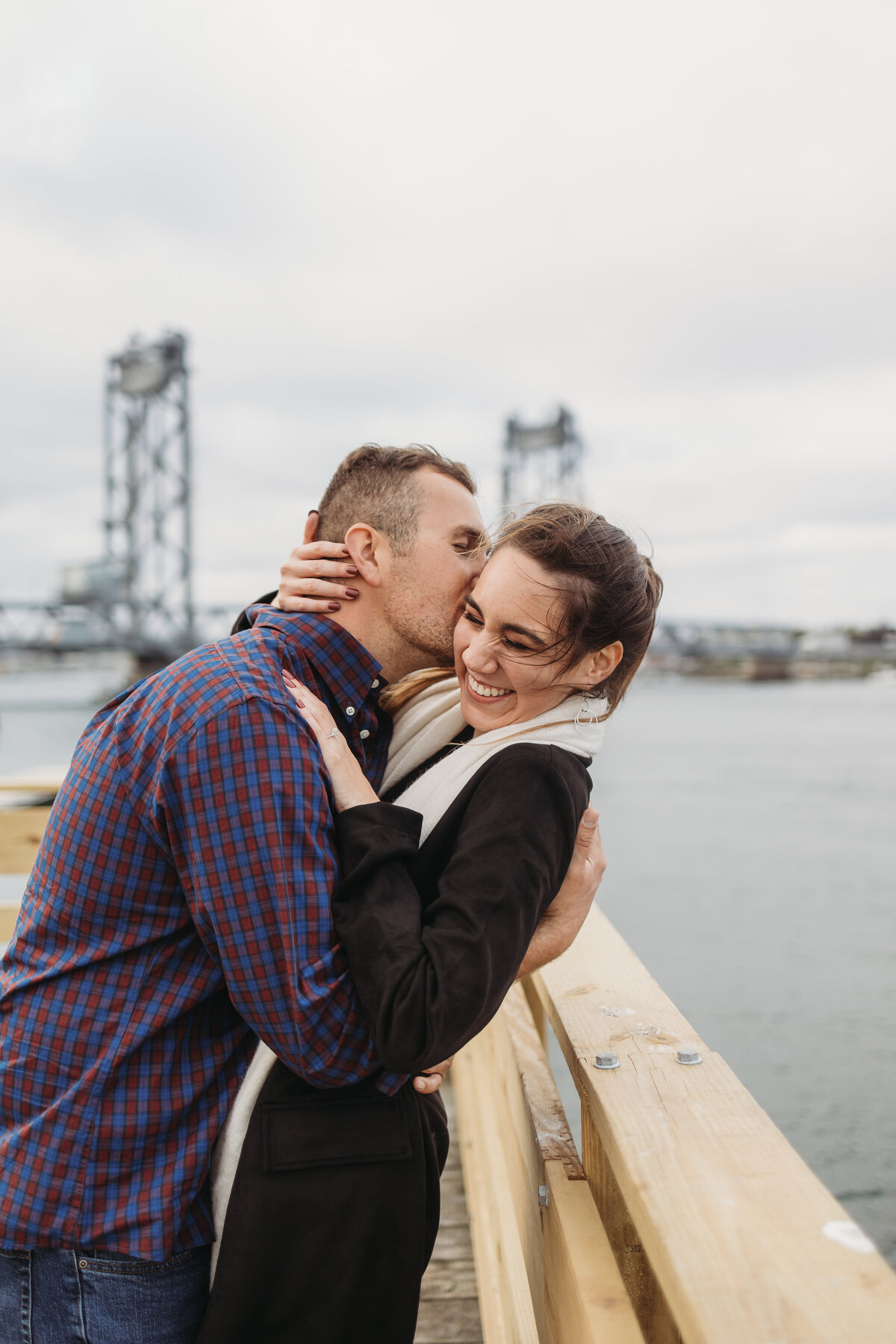 couple kissing on dock