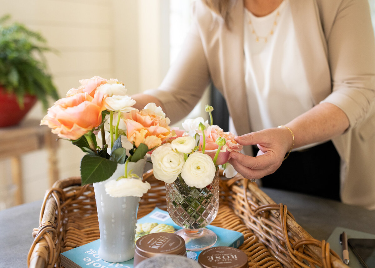 Women making beautiful rose bouquet in branding photography session