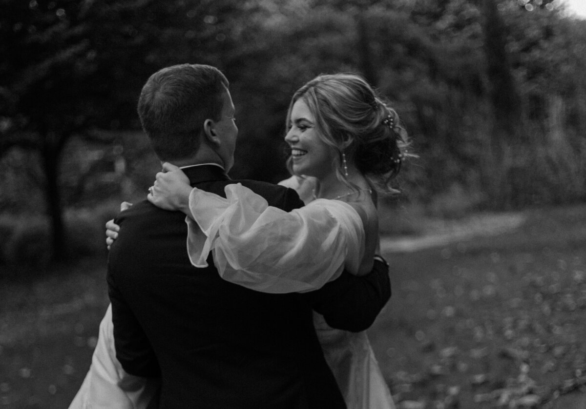 A groom holds his new bride.