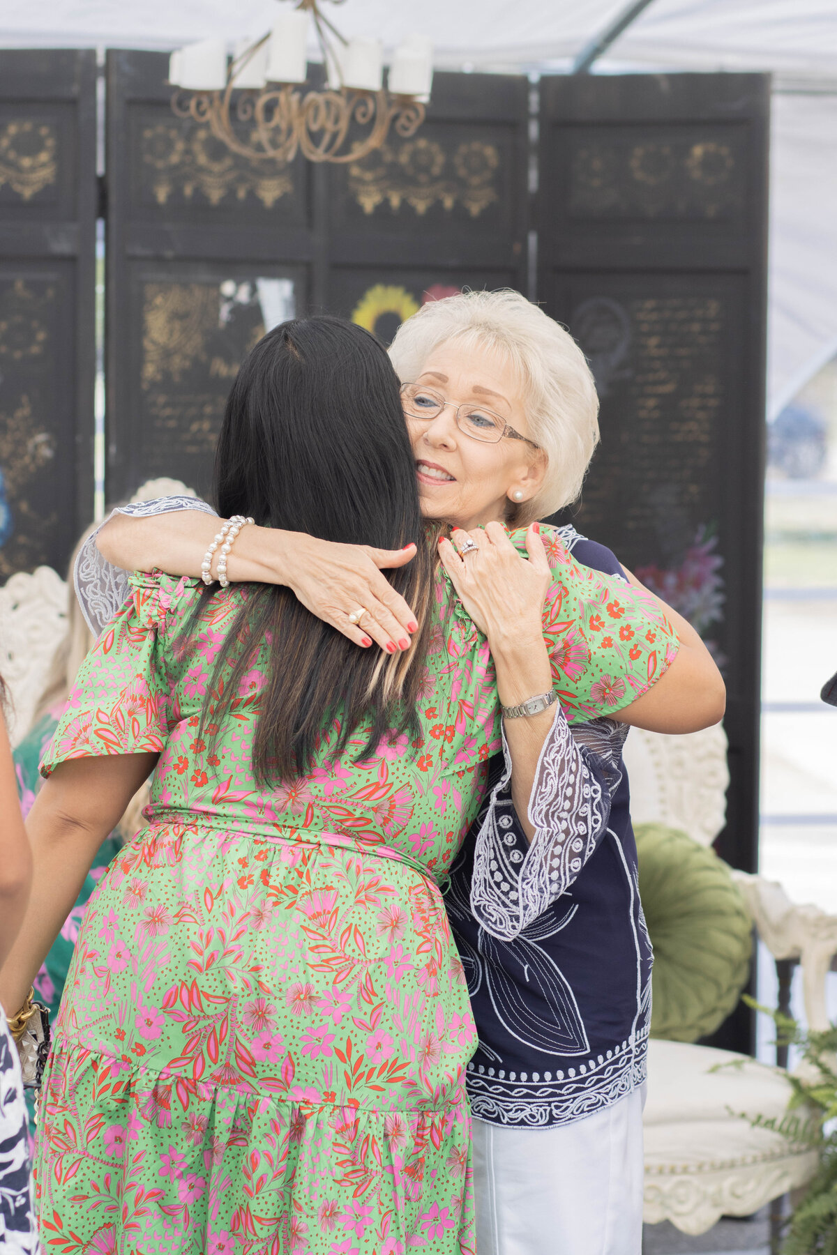 Women hugging at a non-denominational church in Fayetteville, NC.