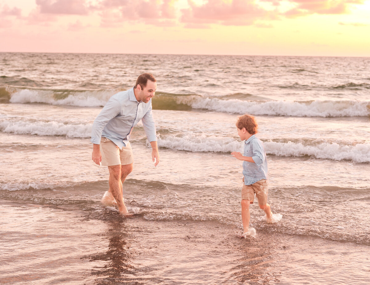 Grandchildren hugging their parents during a Clearwater Beach portrait session.