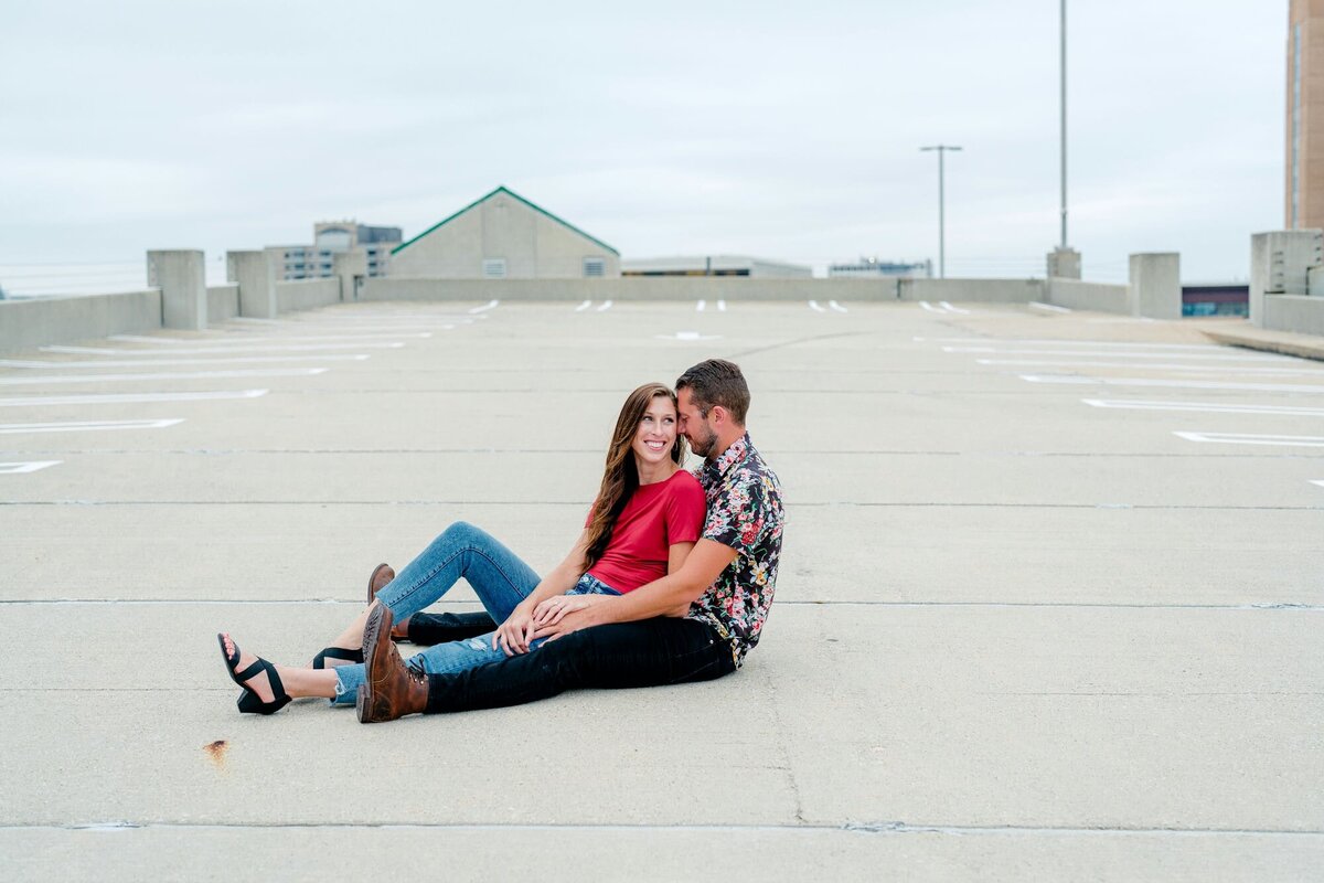 couple-sitting-in-parking-lot-urban-engagement