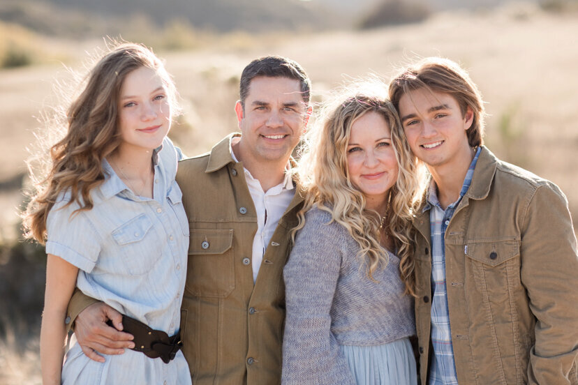 family-of-four-hugging
