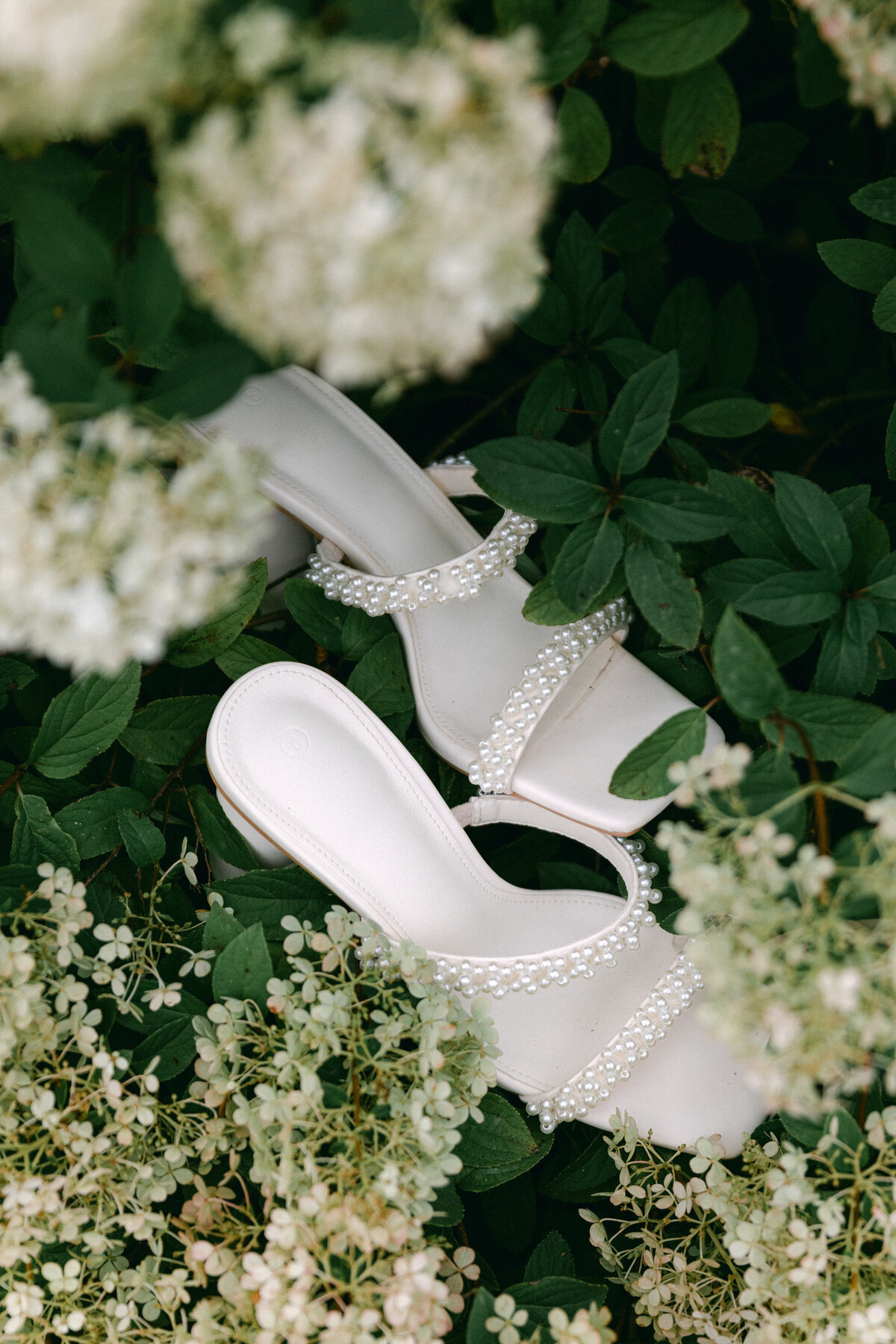 wedding-shoes-in-flowers-bridal-detail-flatlay