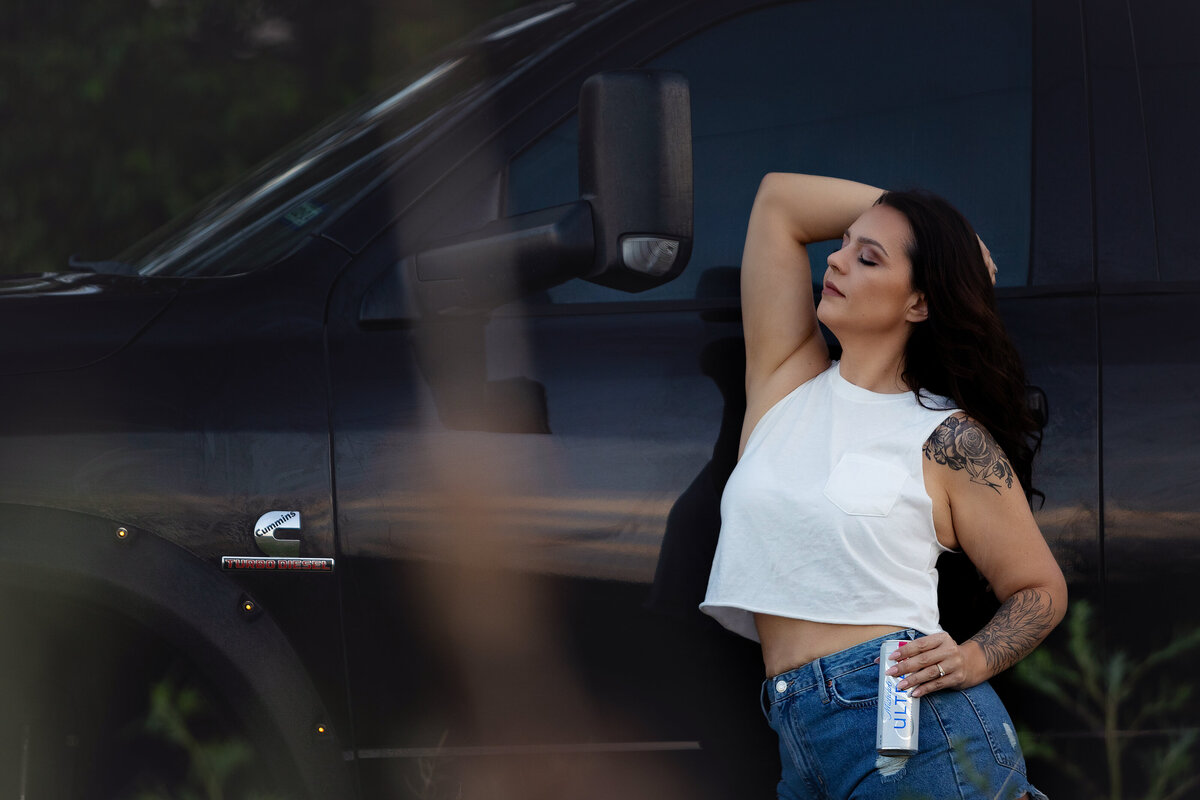 beer and babes boudoir session outdoors by big truck