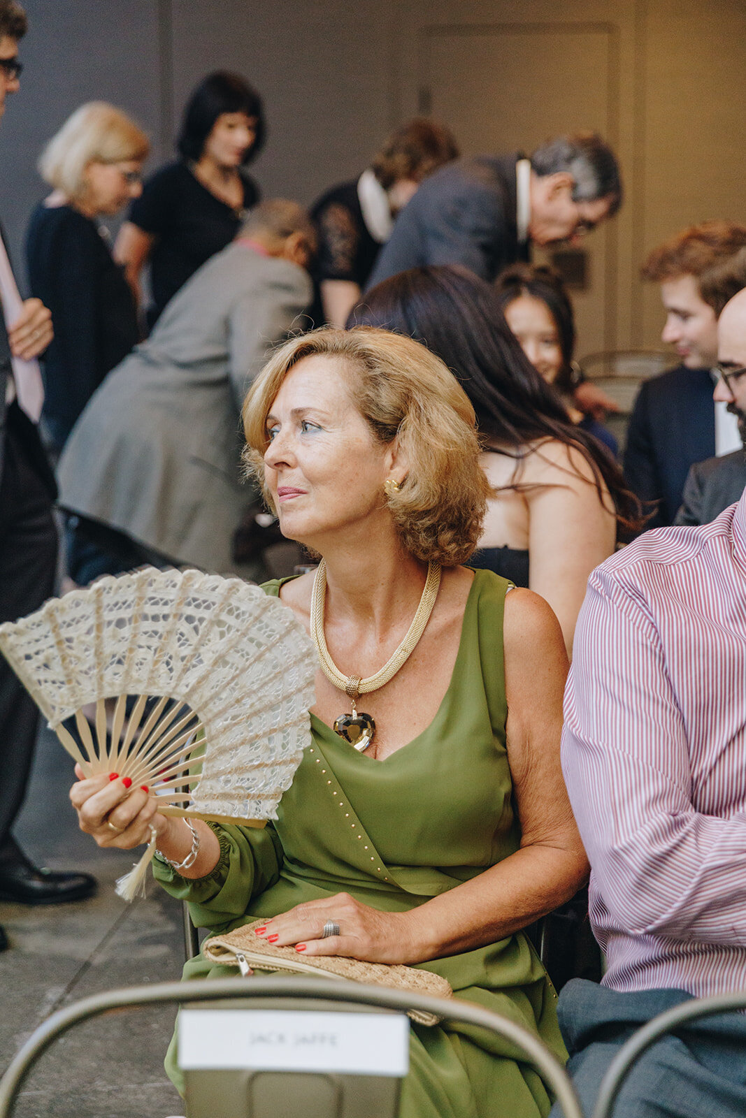 guest in audience at wedding ceremony
