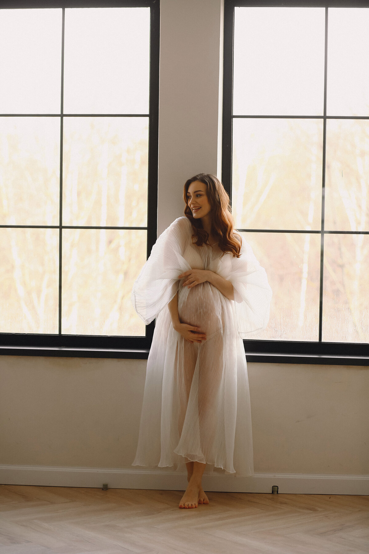 portrait-attractive-pregnant-woman-stylish-white-dress-posing-near-windows-studio