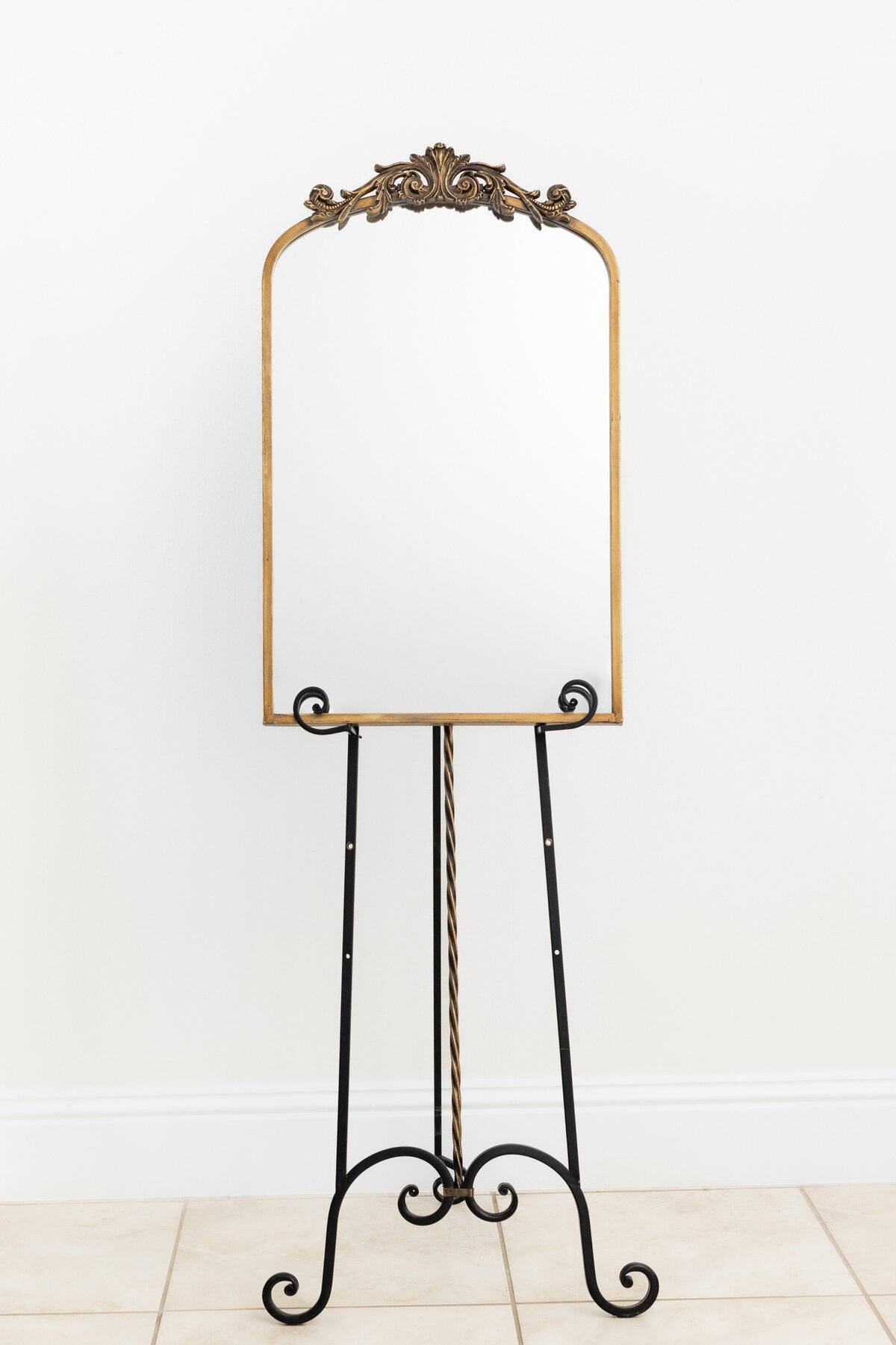 Medium arch mirror with ornate ornament on top