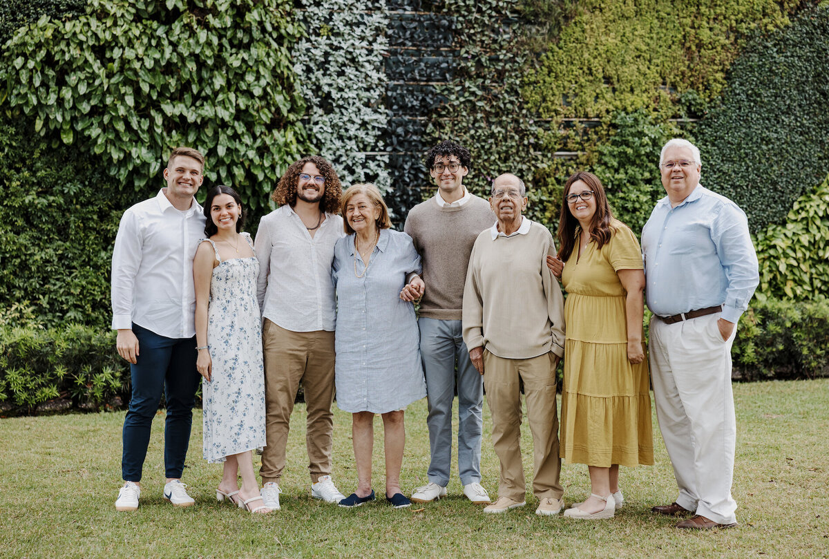 family of eight poses for photos in south florida