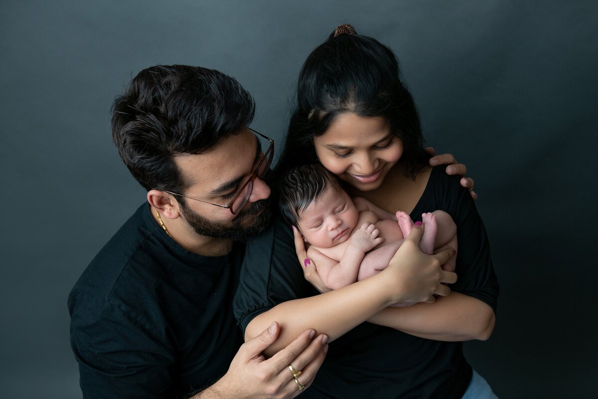 indian-parents-with newborn-in studio