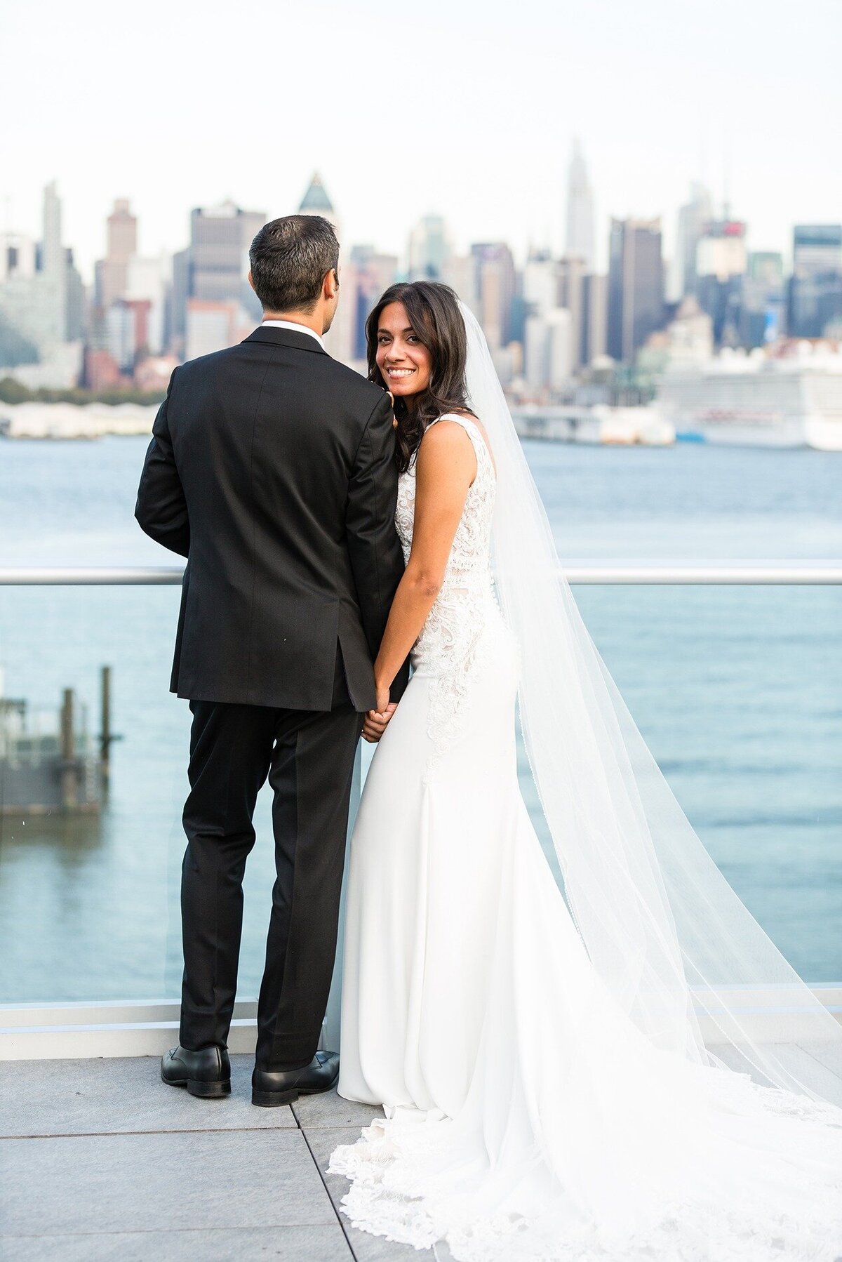 bride-peeking-over-groom-shoulder