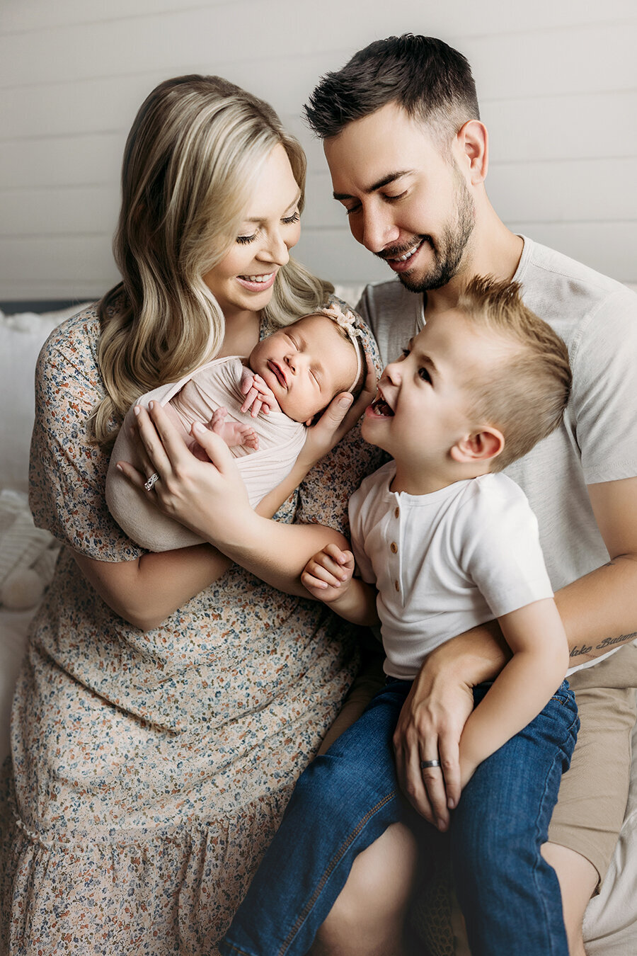 Adorable new family welcoming their newborn baby girl