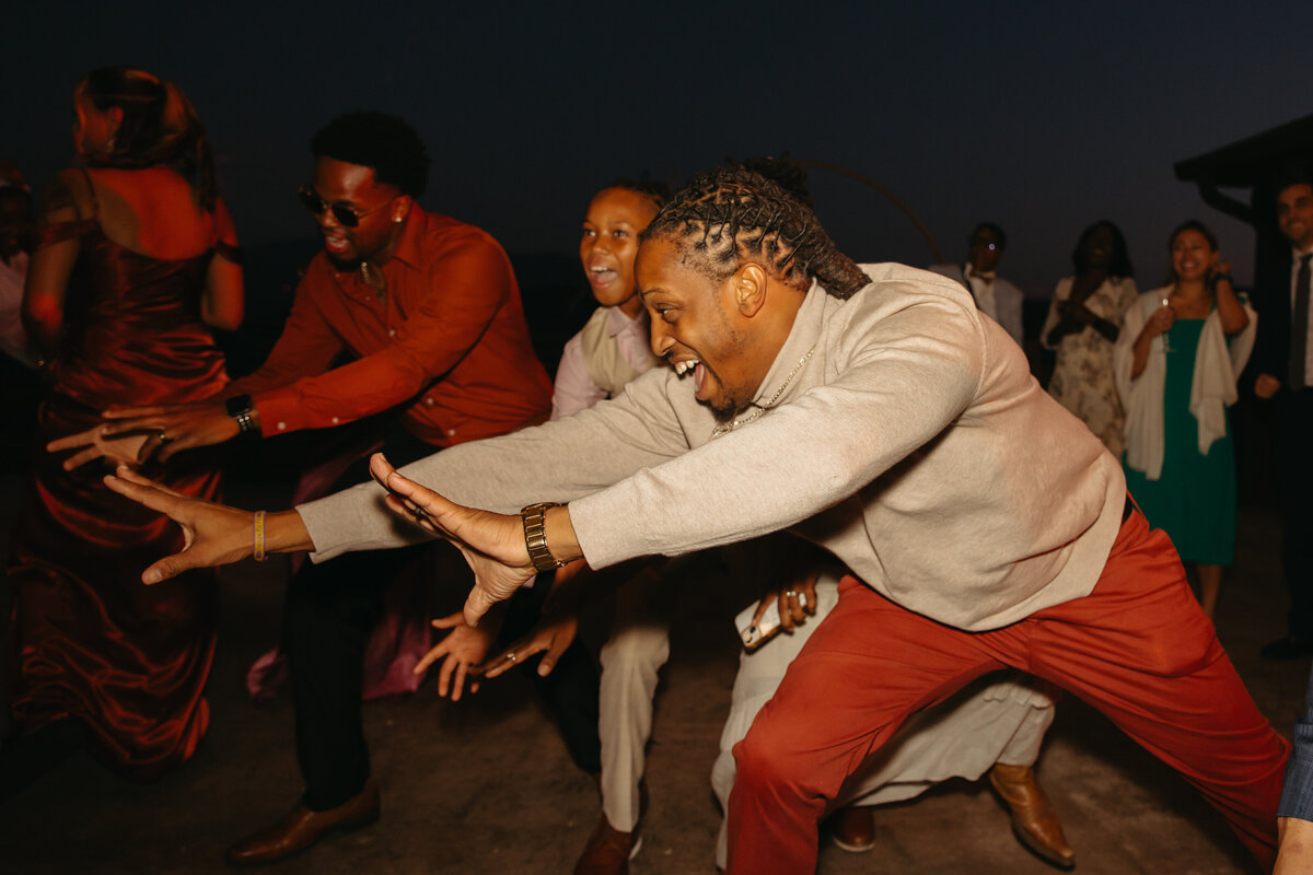 guests dance to song at wedding