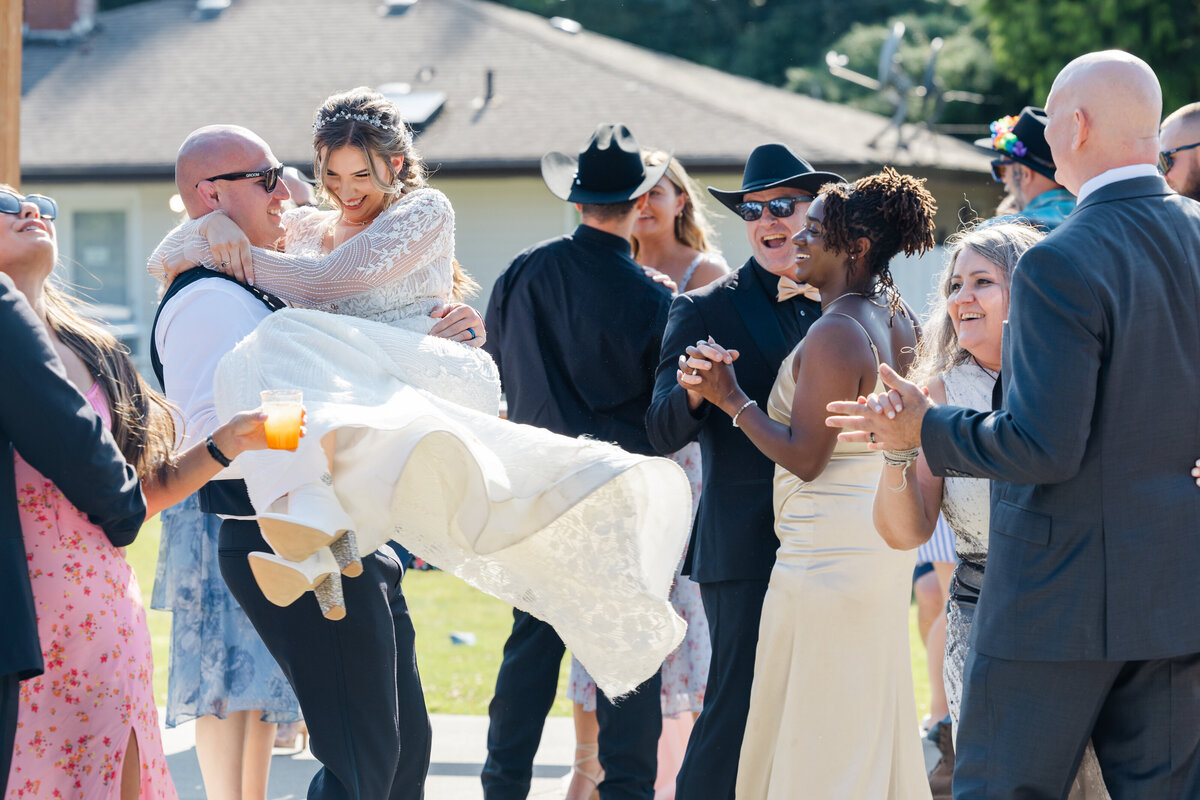 first dance wedding room lifts and twirls bride