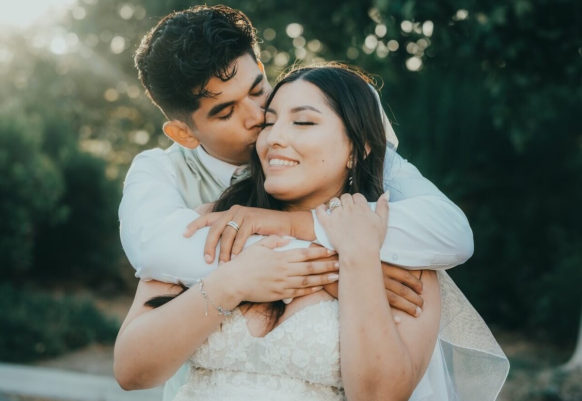 A romantic moment between a newlywed bride and groom in Paso Robles, California.