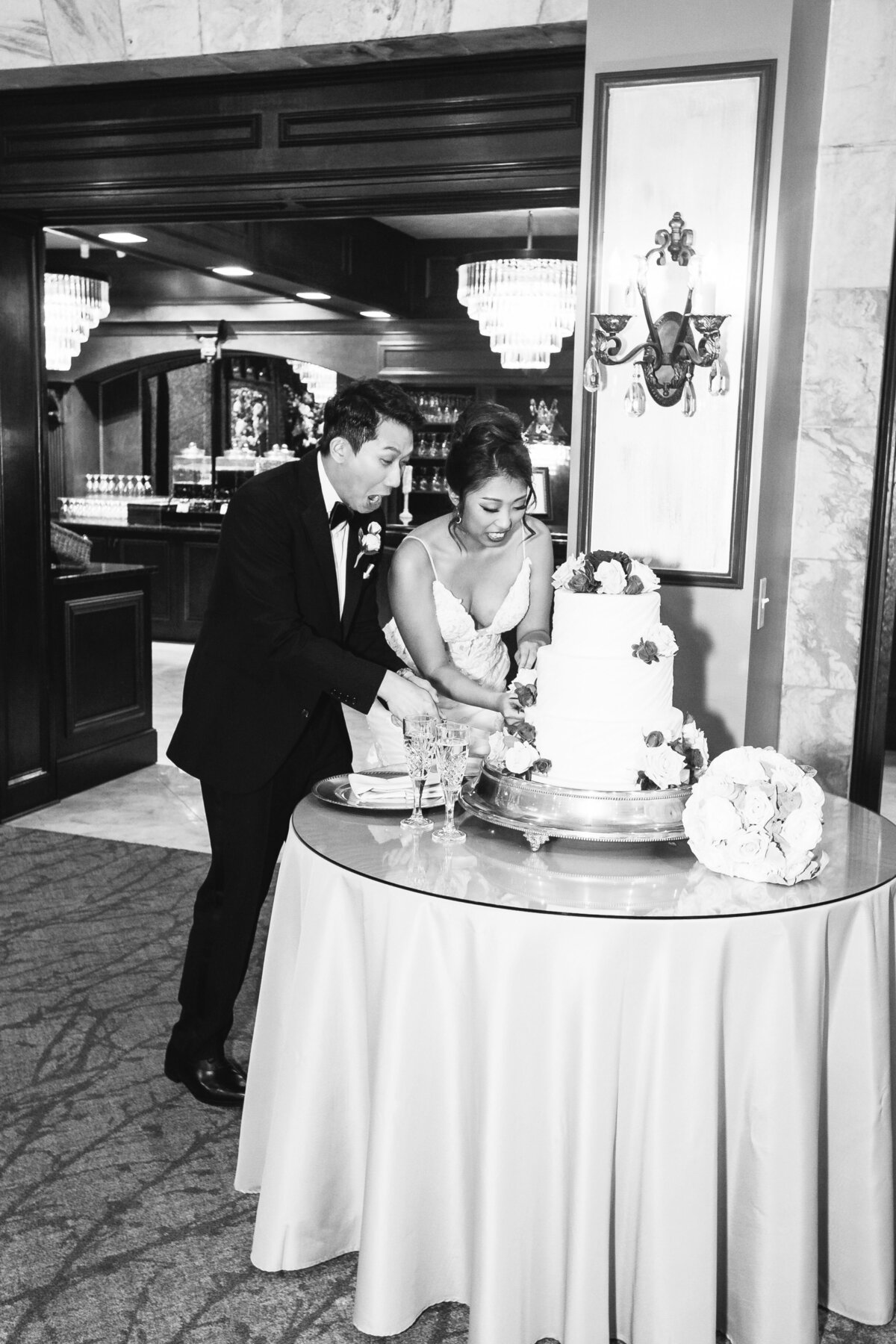 Bride-and-Groom-Cutting-Wedding-Cake-Tate-House
