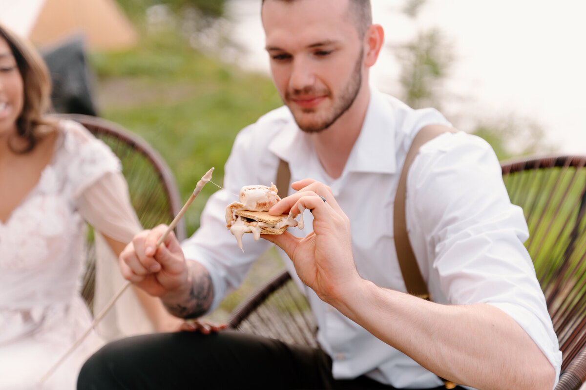 groom making a smore