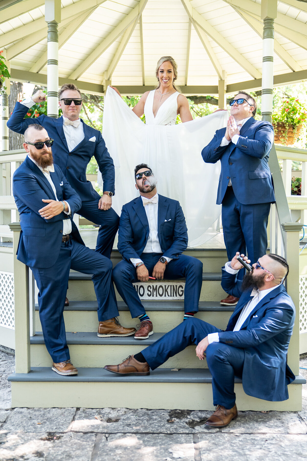 Groomsmen in blue suits pose with bride in Saint Paul, Minnesota.