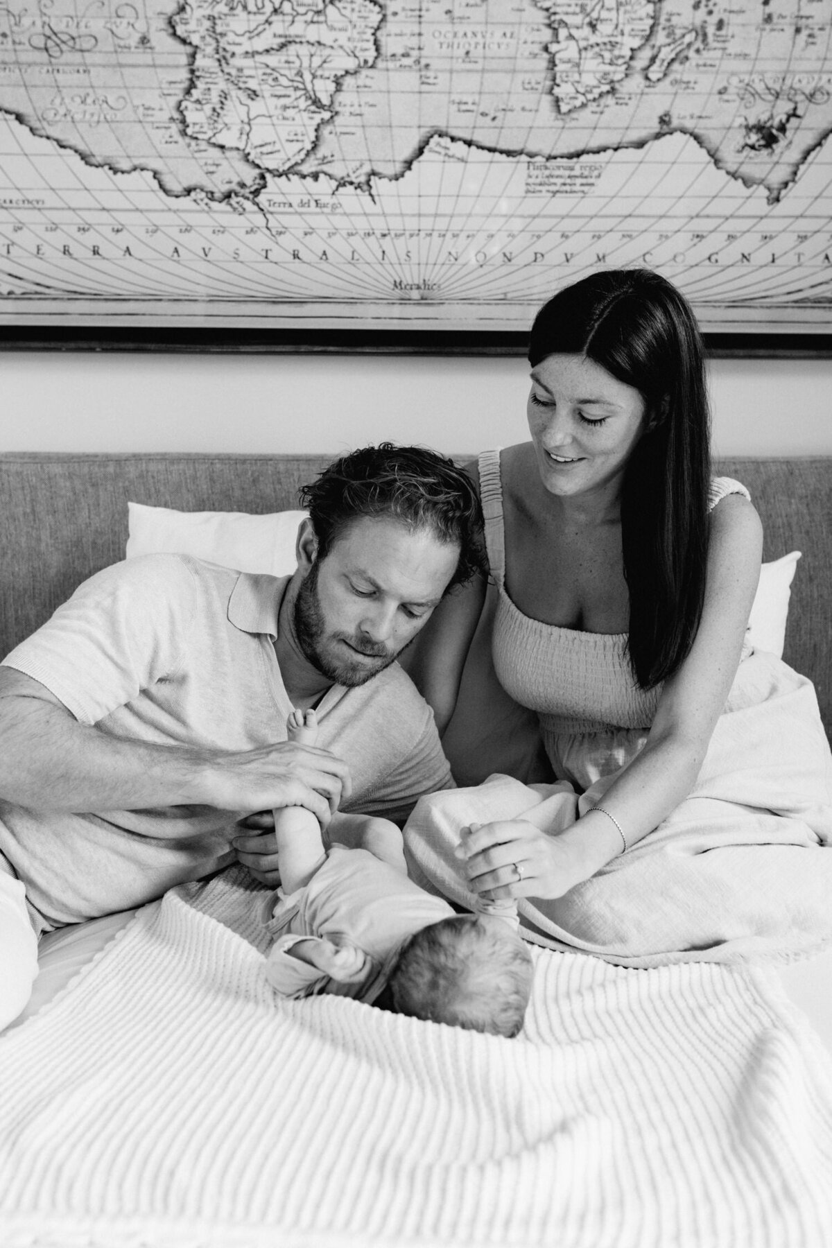 Father holding baby during lifestyle family photoshoot in Zurich