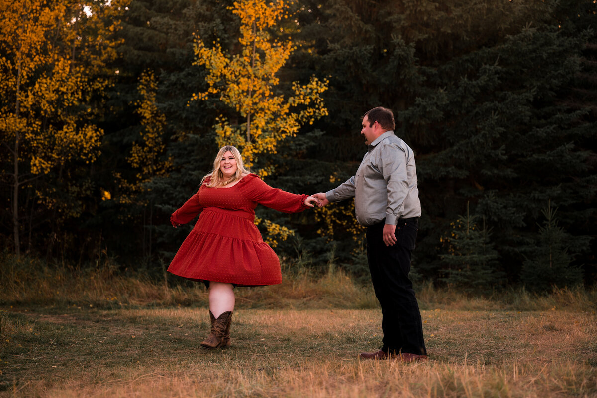 a couple dancing in a field at sunset in Edmonton