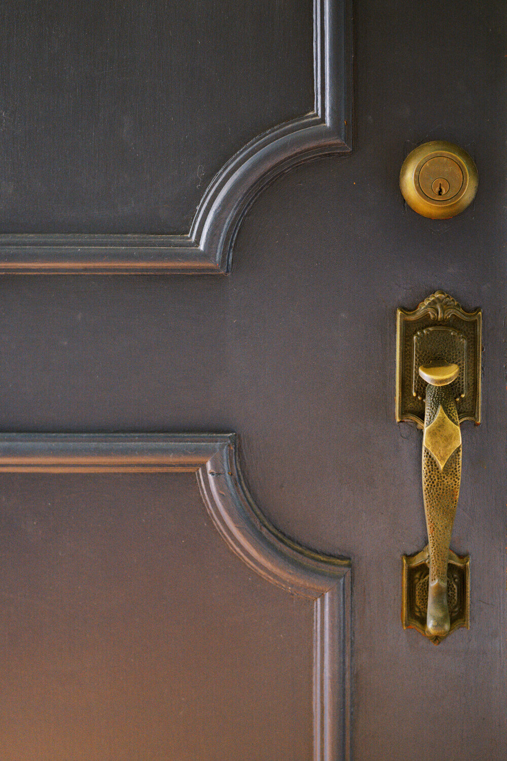 antique-doorhandle-on-black-door