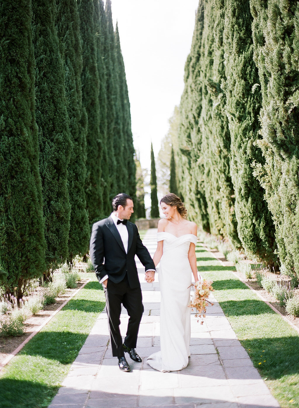 couple walking down greystone mansion