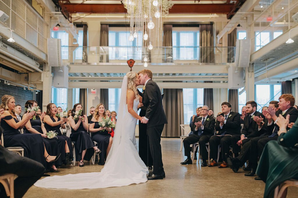 Bride and Grooms first kiss at Machine Shop Wedding