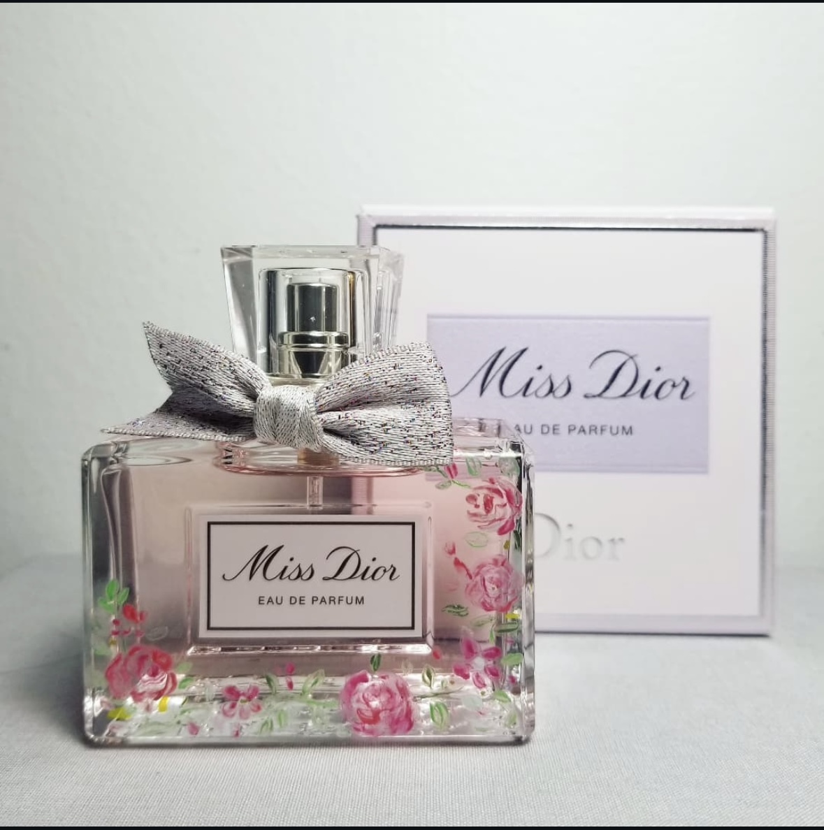 Floral bottle painting on luxury Miss Dior perfume by Toronto artist Jenny Zhang
