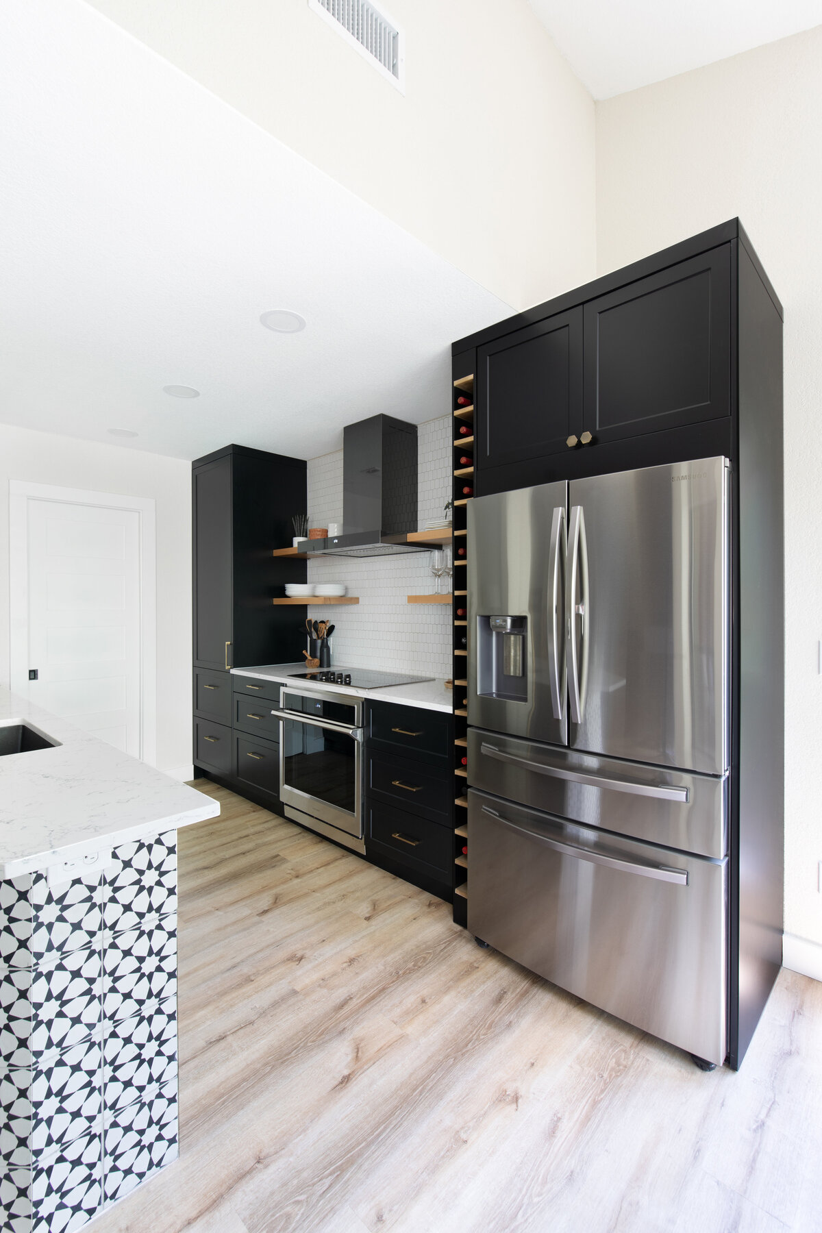 hello-home-austin-modern-black-and-white-kichen-remodel-wine-storage-open-shelves-black-cabinets-patterned-wall-tile-25