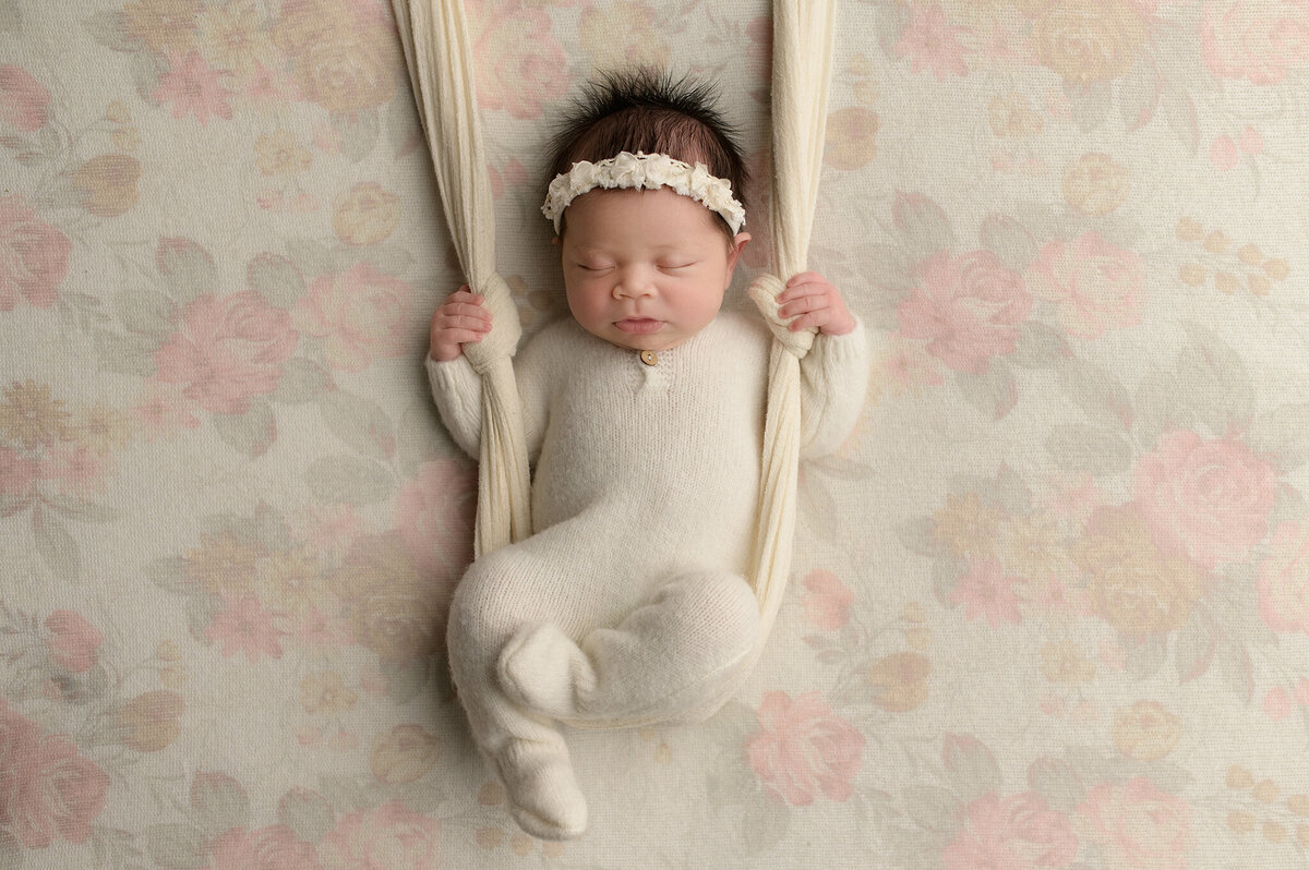 Baby in white romper