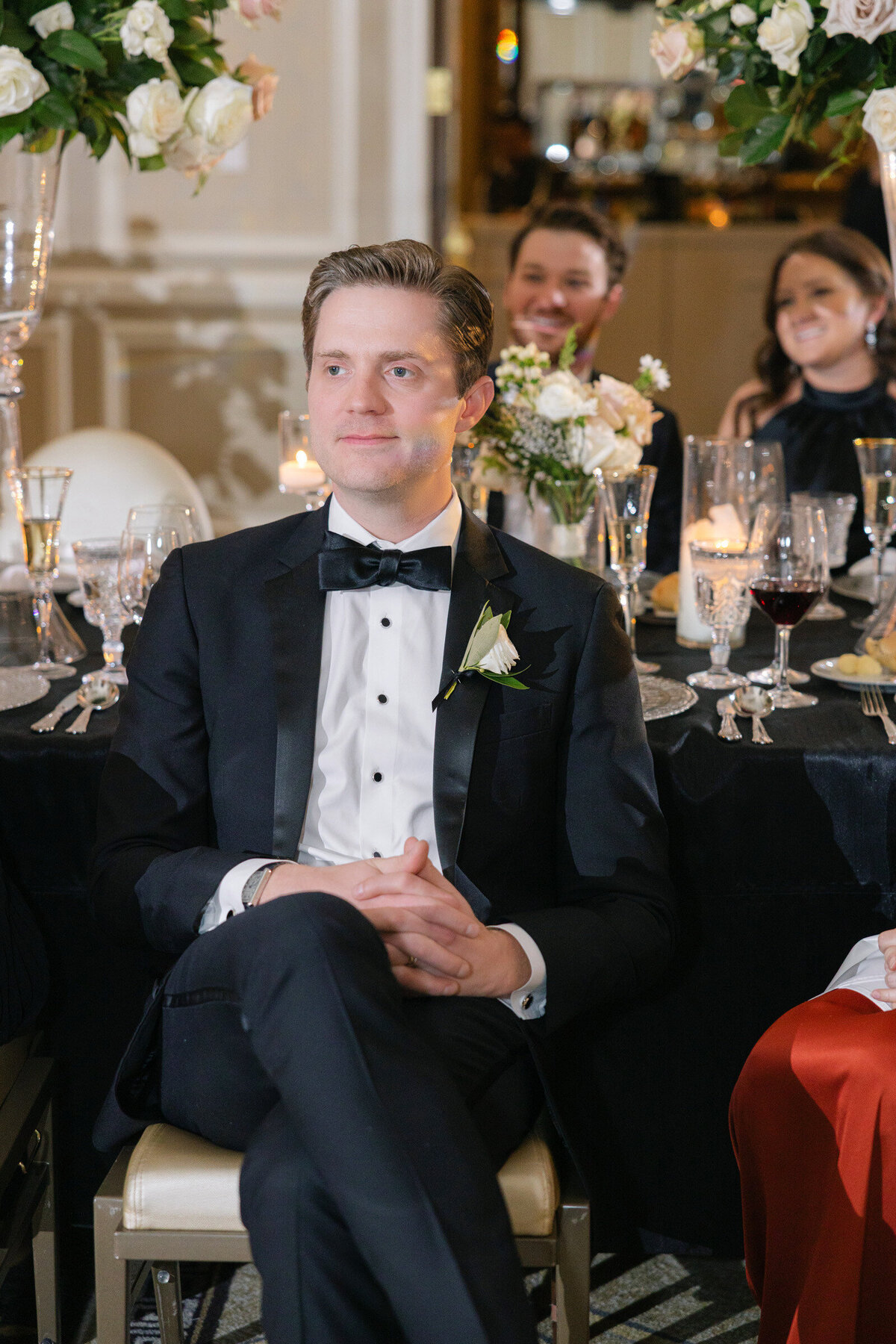 Candid portrait of a guest at the wedding reception at The Adolphus in Dallas
