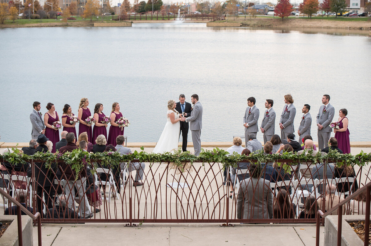 Bride and groom take their vows at their waterfront wedding ceremony