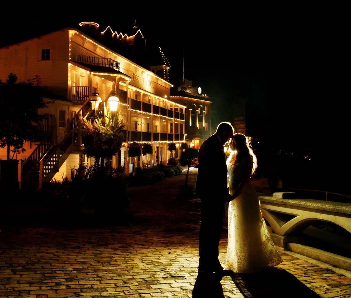 Bride and groom at night in front of Hotel DeHarro in Roche Harbor Resort