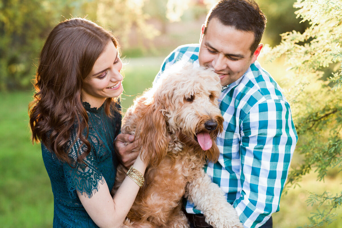 couple playing with their dog