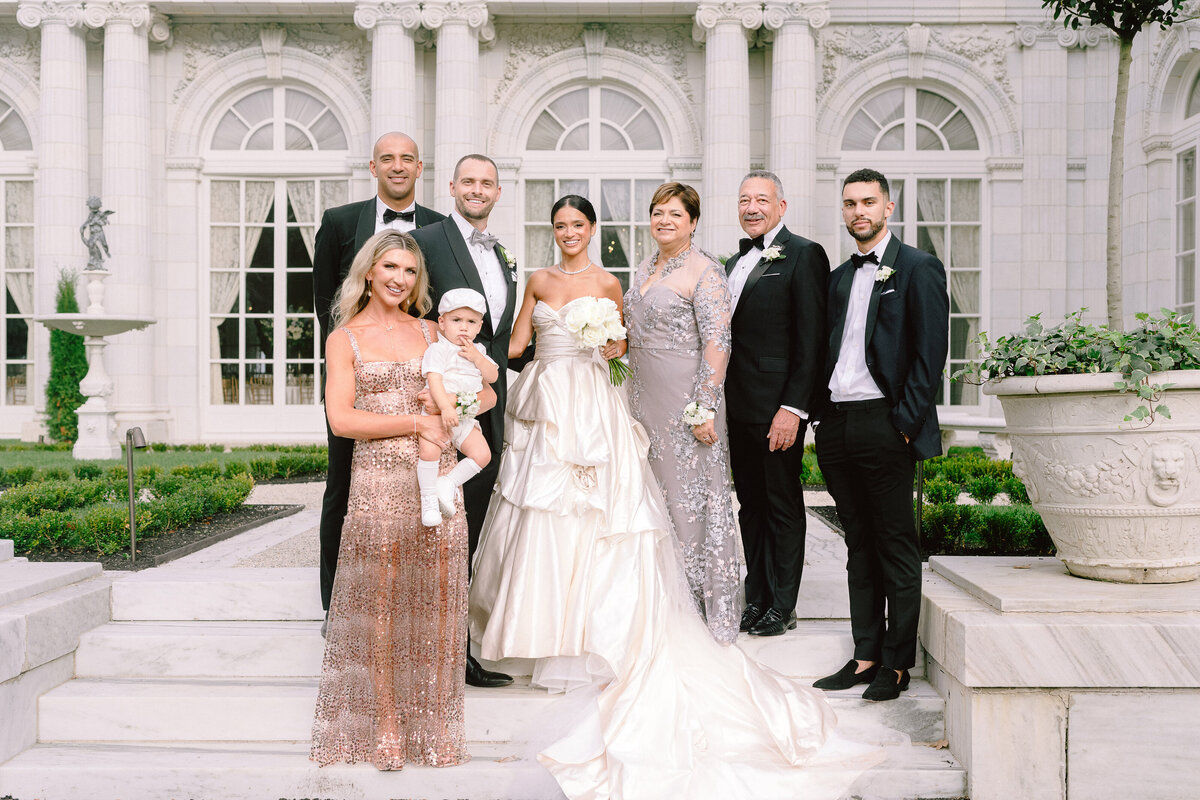 A family poses for a formal portrait outside Rosecliff mansion in Newport