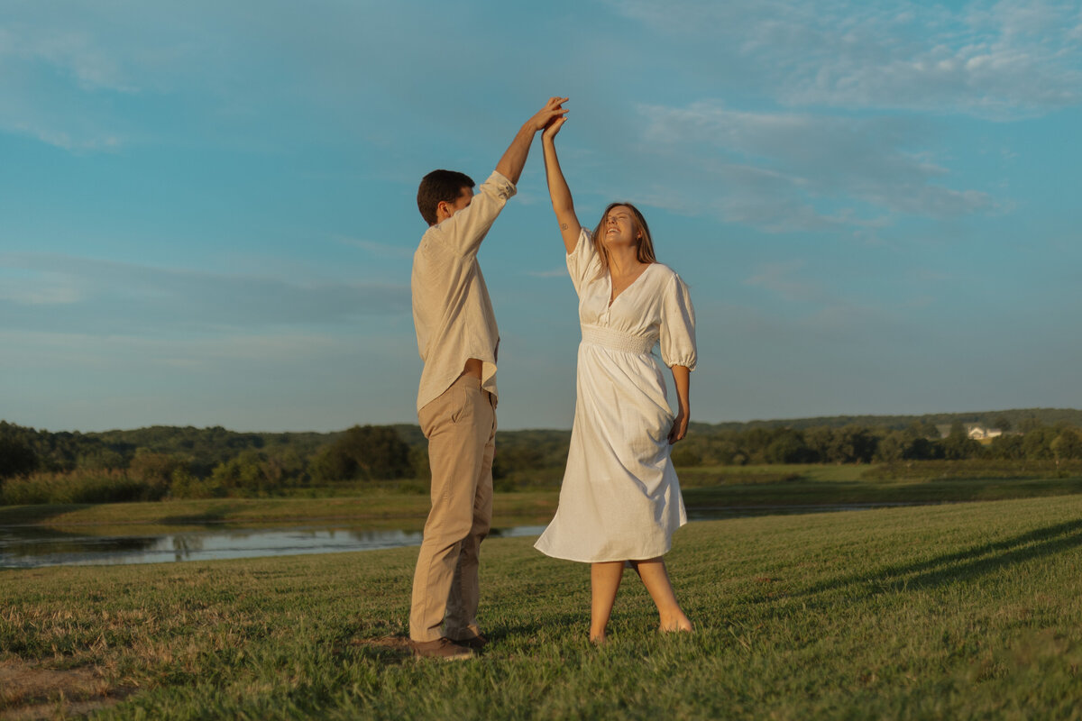 Sunlit picnic moment during a couples session in a vibrant tropical winery setting

