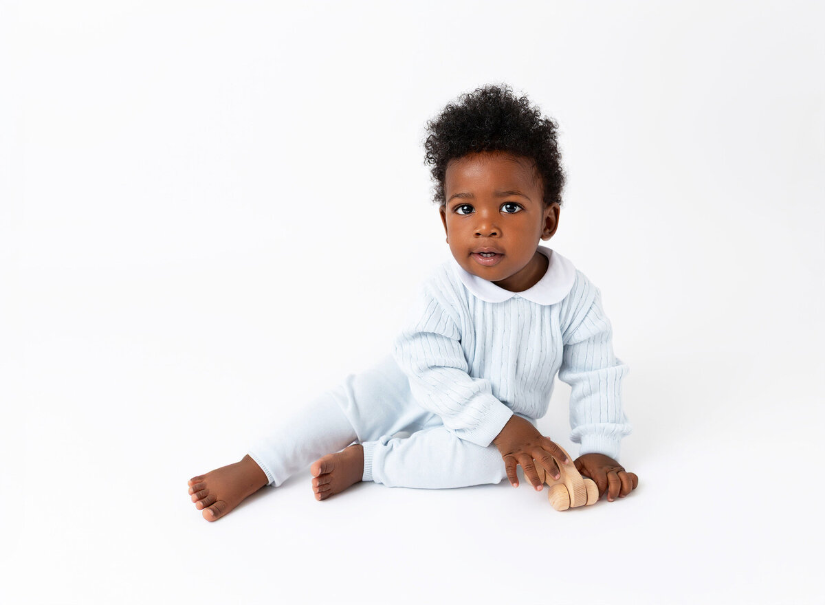 Baby boy in a light blue classic and timeless outfit for his heirloom photoshoot in Brooklyn