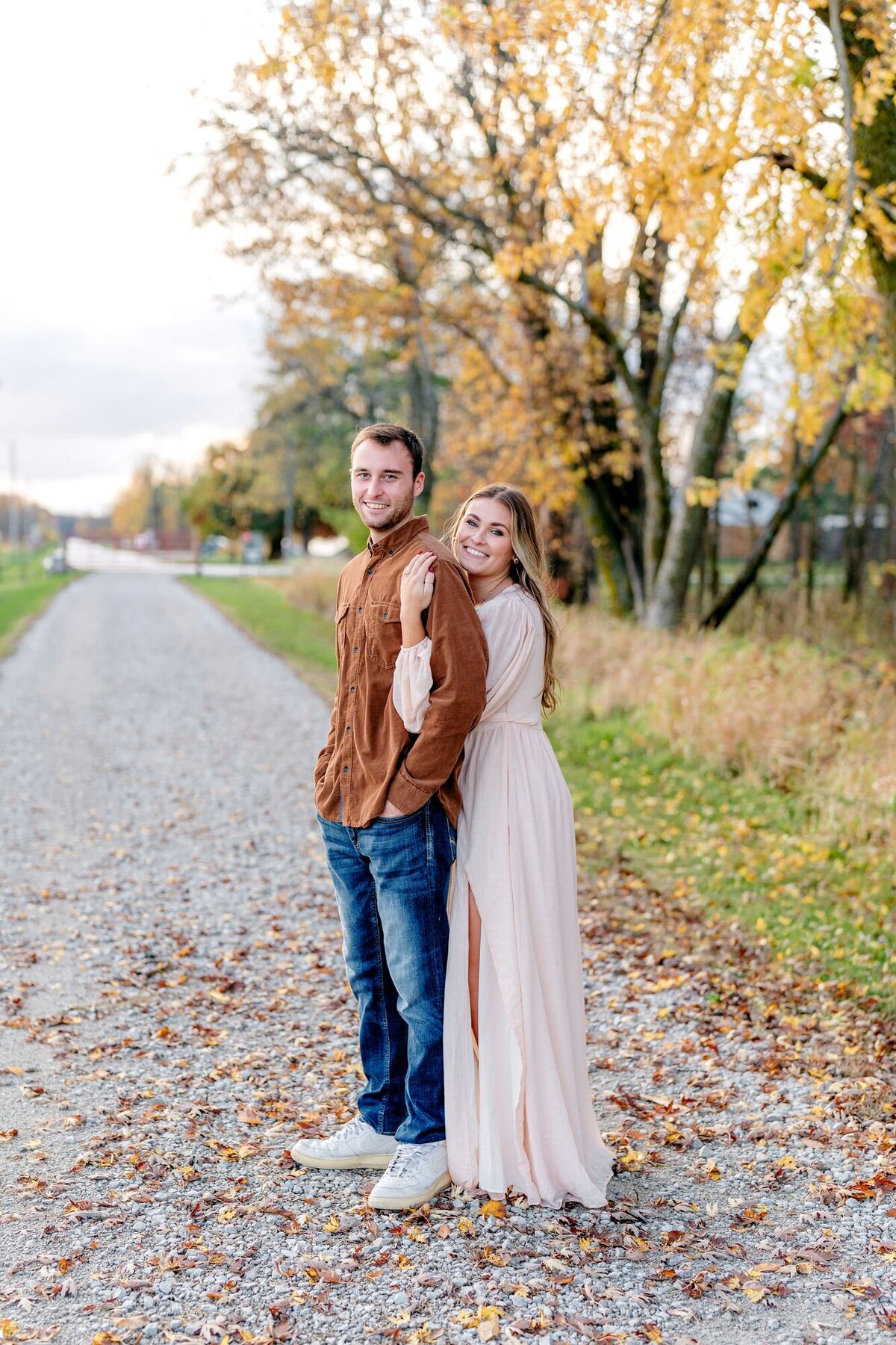 couple-embracing-fall-street