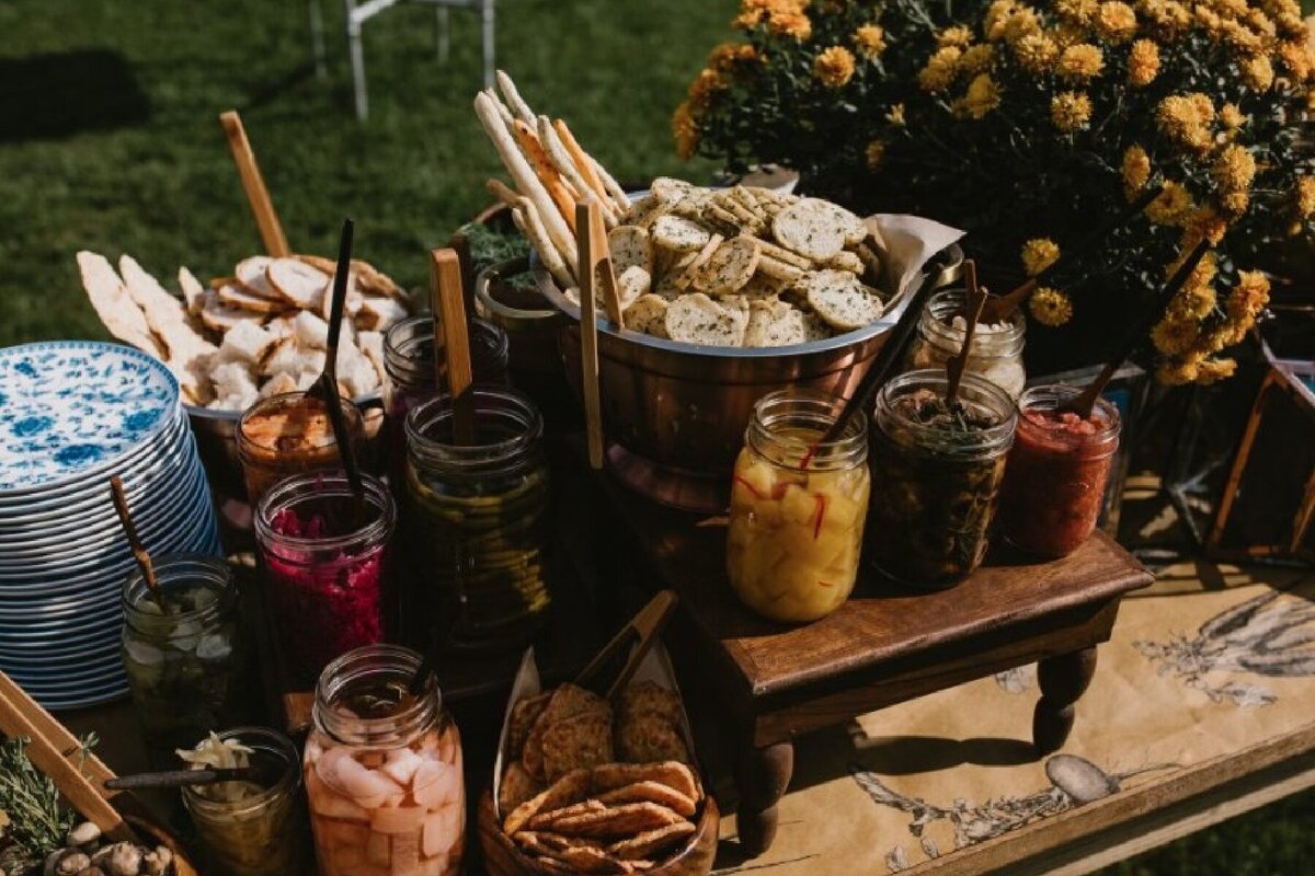 farmer's table appetizer display of pickled and preserved vegetables at Willowbrook wedding venue