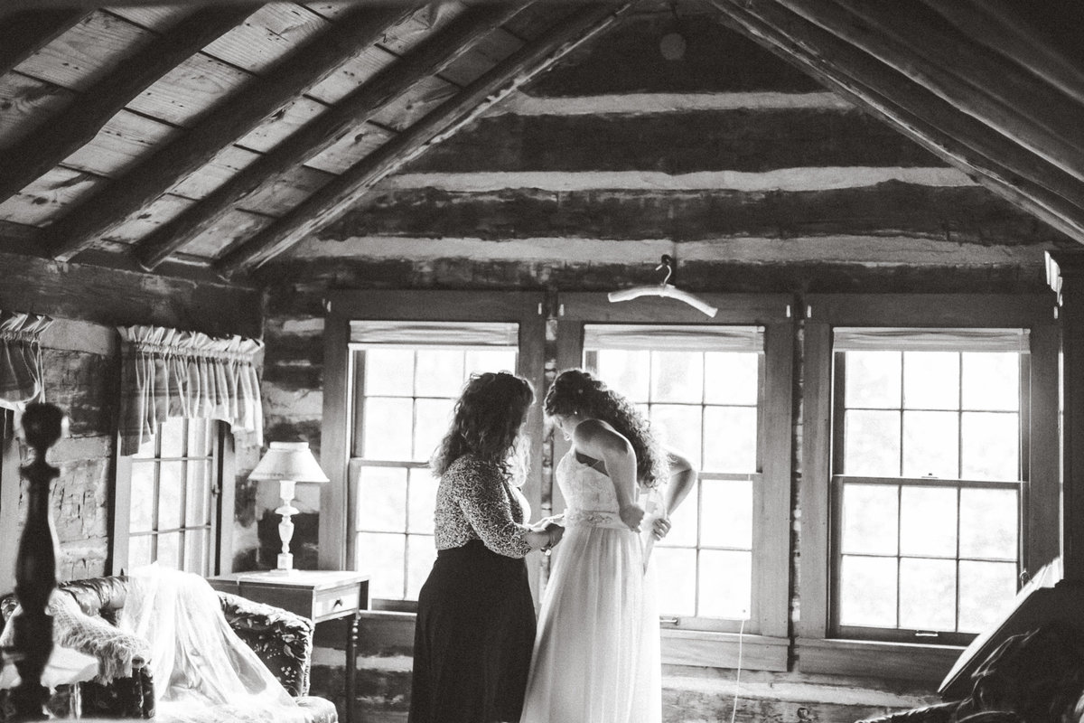 Black and white photo of bride getting ready