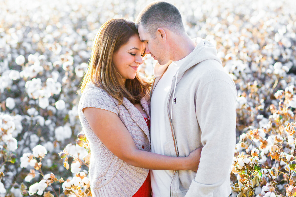 couple embracing in cotton field