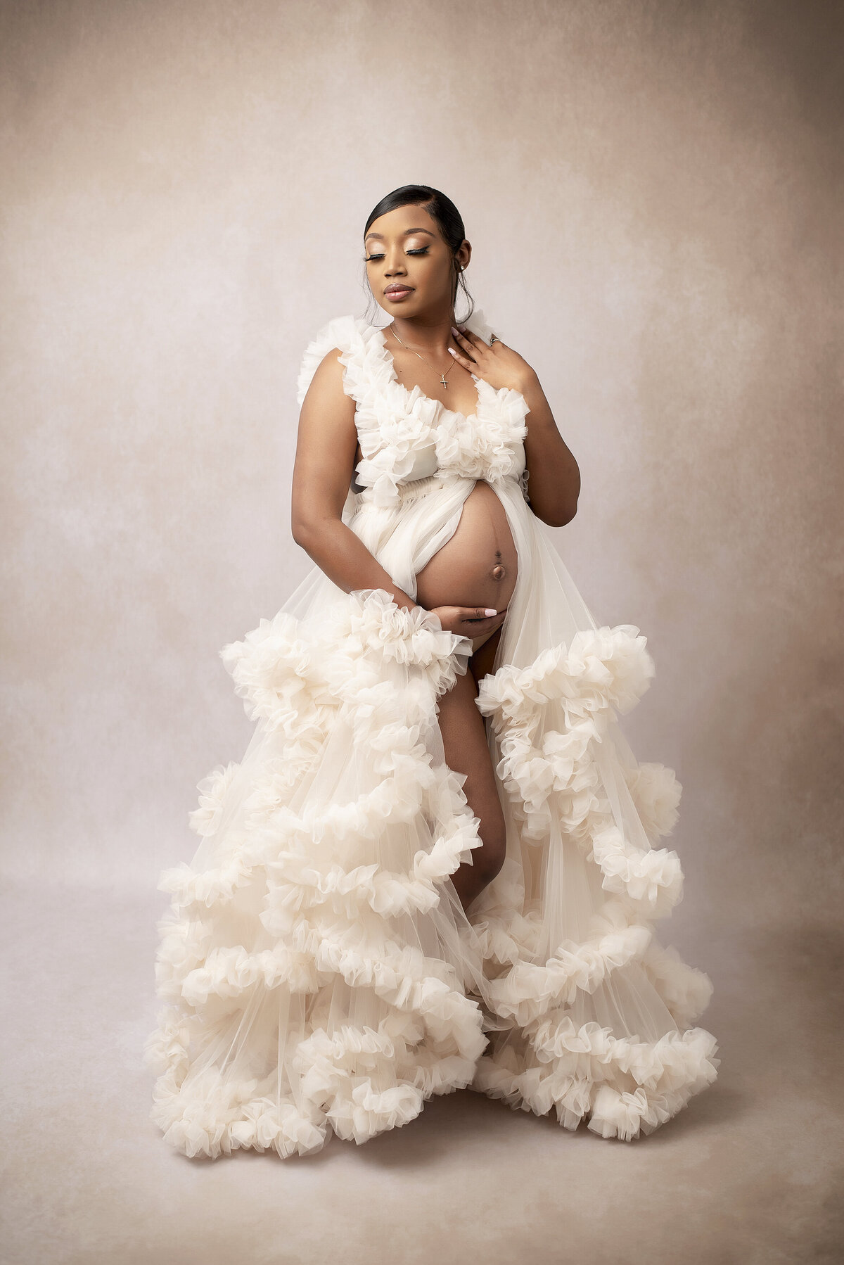Maternity photo of woman wearing white