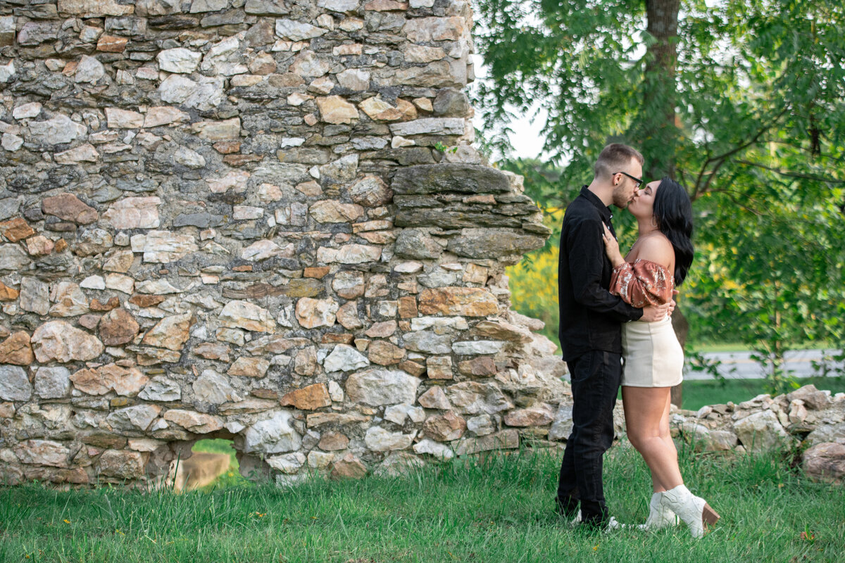 secret_engagement_kiss_stone_wall_1