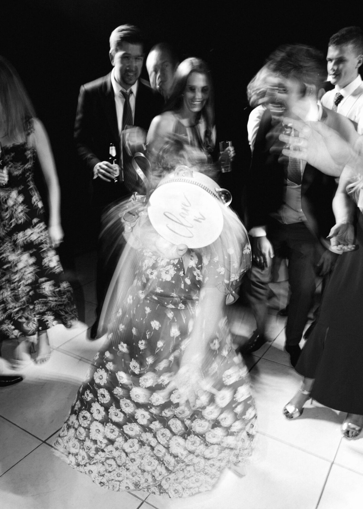 chloe-winstanley-weddings-guest-dancing-tambourine