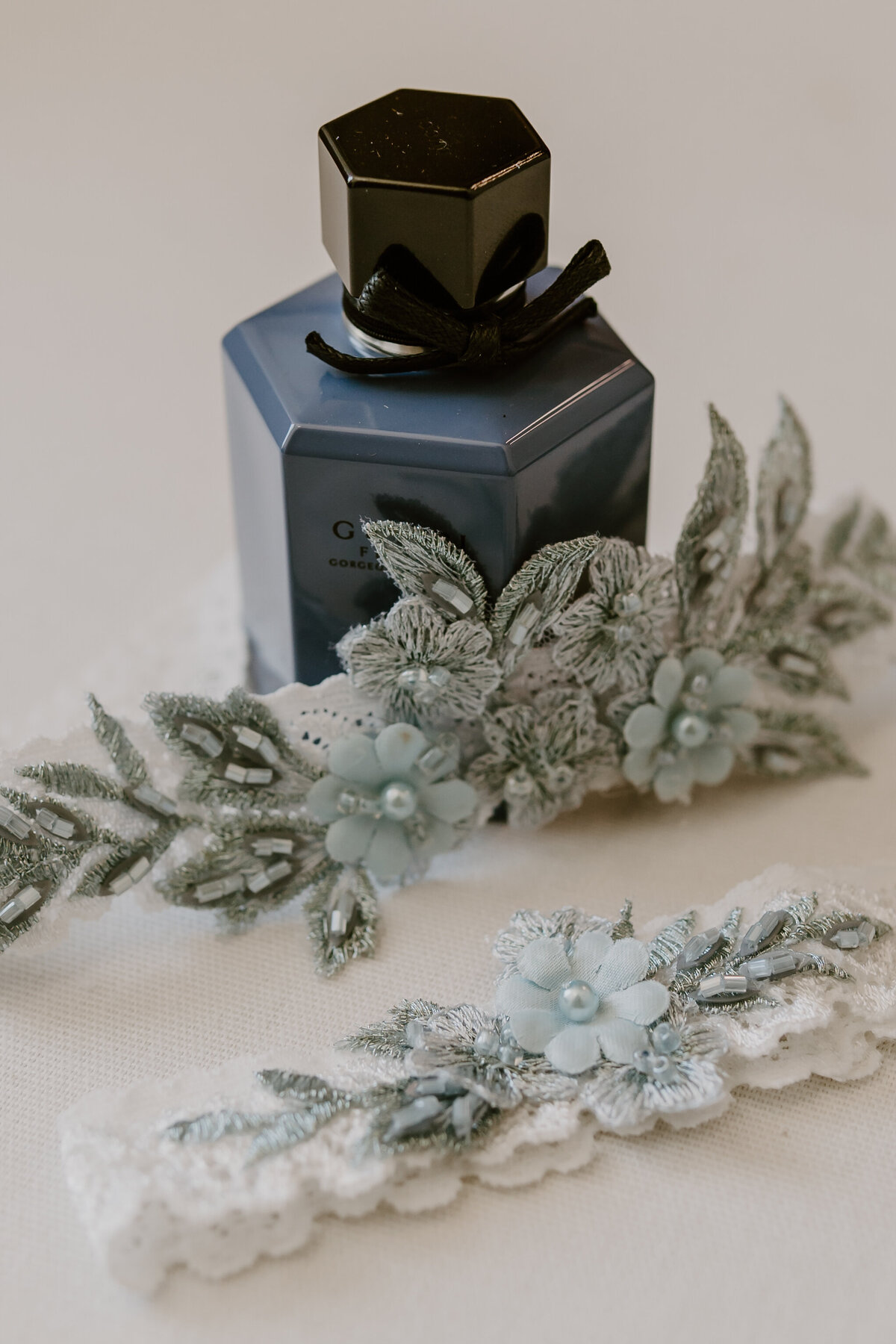 wedding-details-flatlay-with-purfume-emerald-hills-events-promise-city-iowa-des-moines-wedding-photographer-storyteller-collective-photo-co